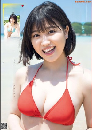 A woman in a bikini sitting in a pool.