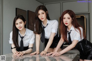 A group of three women sitting on top of a couch.