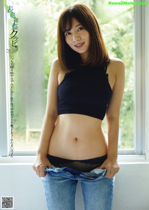 A woman in a red dress sitting on the ground.