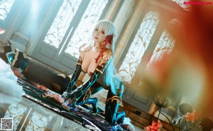 A woman in a bikini holding a sword in a room.